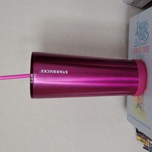 Fusia Starbuck cup with straw.